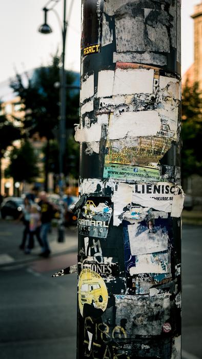 advertising sheets on the pillar in the city