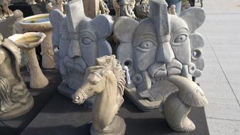 The stone faces of the sculptures