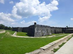 old castle black by the grass