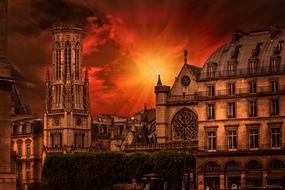Beautiful architecture of Paris, France, at colorful and beautiful sunset in the evening sky with clouds