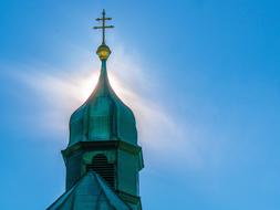 dome of the church with a steeple and a cross