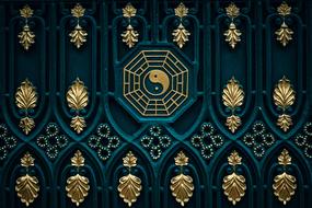 Beautiful, green and gold fence with the Yin Yang sign and patterns