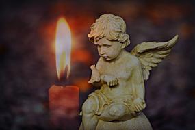 Angel figurine and candle