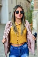girl in a pink sweater on the street