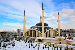 People near the beautiful Cami in snow, in Ankara, Turkey