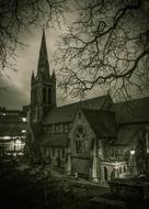 Black and white photo of the beautiful St Peter's Church with lights at night, in Bournemouth, England