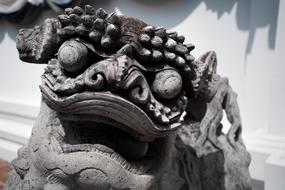 dragon head, aged stone carving, thailand, Bangkok