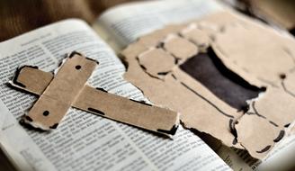 Cross on bible book