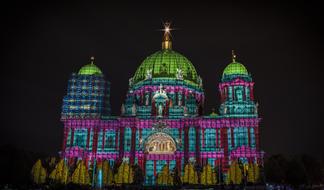Beautiful Berlin Cathedral in colorful lights, at night, in Germany