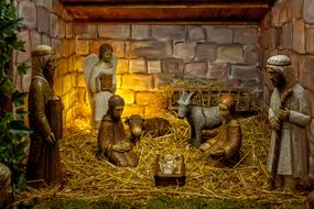 figures of the birth of Christ in a sty