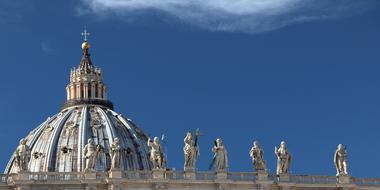 The Vatican Dome and beautiful sculptures on the roof