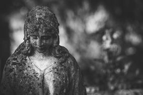 mourning woman, detail of old stone Sculpture on cemetery