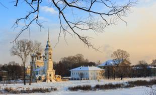 distant view of the village church in winter