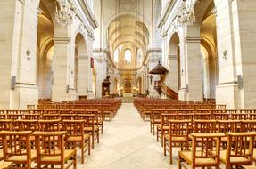 Beautiful architecture of the church with the wooden chairs