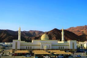 amazing Cami Masjid with the beautiful background with the mountains