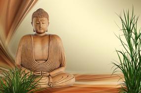 Beautiful statue of Buddha, in meditation, near the green plants