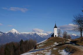 chapel in the mountains of slovenia on a sunny day