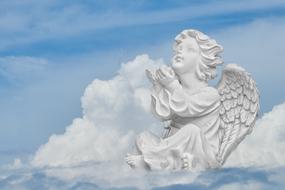 sculpture of an angel in the clouds