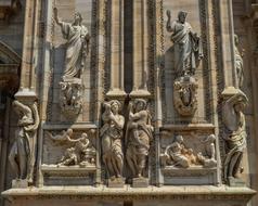 sculptures on the wall of a church in Milan