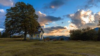 distant view of the chapel under the tree at dusk