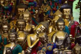 Beautiful and colorful, shiny statues of Buddha in the monastery in Ladakh, India