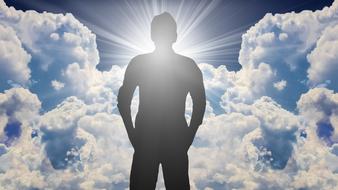 silhouette of a man against the backdrop of a bright sun