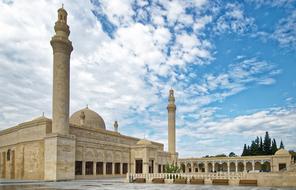 Beautiful Juma Mosque in Shamakhy, Azerbaijan, under the blue sky with white clouds