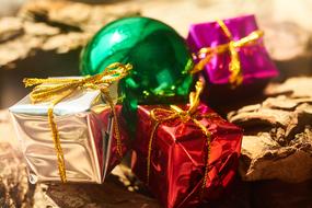 christmas gifts with shiny colorful balls close up