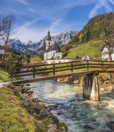 painted white chapel by the river in Ramsau am Dachstein, Austria