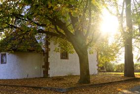 bright sun behind the walls of the white chapel