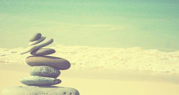 Zen, stack of pebble Stones in front of sea