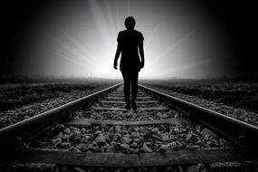 Faith Beyond Death, human silhouette walking on railway to light, digital art