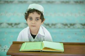 Hafiz student, sitting in the Cami in Ä°stanbul, Turkey