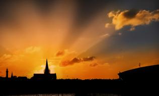 Sunrise Rays over Church silhouette, denmark, bornholm