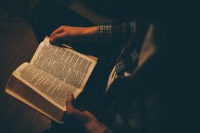 Man Sitting with holy book