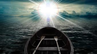 fishing boat against the background of the Christian glow