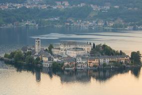 panorama of buildings on the island in orta san giulio, italy