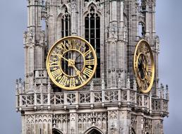 clock on the tower of the cathedral in flanders