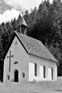 white chapel in the mountains in black and white background