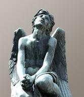 bronze sculpture of an angel in a cemetery in Florence