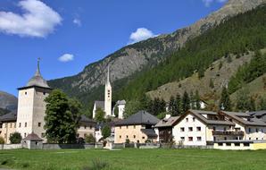 old church in village at scenic mountains, Switzerland, Zernez