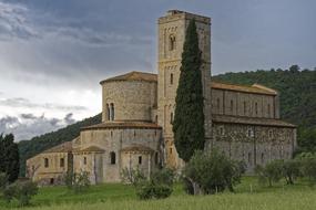 church under dark clouds in tuscany