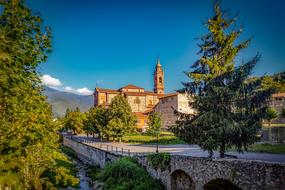 Beautiful architecture among the colorful plants in Garessio, Piedmon, Italy