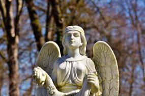 Angel Figure in the cemetery on a sunny day