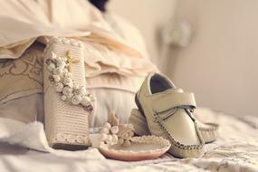 Beautiful, decorated shoes and clothing for baby Baptism