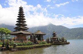 Beautiful landscape of the colorful Pagoda, among the lake and mountains in Bali, Indonesia