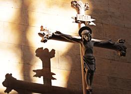 crucified Jesus Christ on a wooden cross in a church