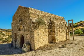 Beautiful, stone chapel, among the green and yellow fields in Ayia Elissavet, Cyprus, Greece