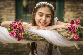 photo of a girl and flowers on the background of the church