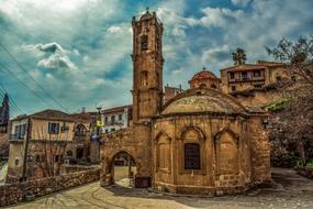 antique church against the cloudy sky in Cyprus